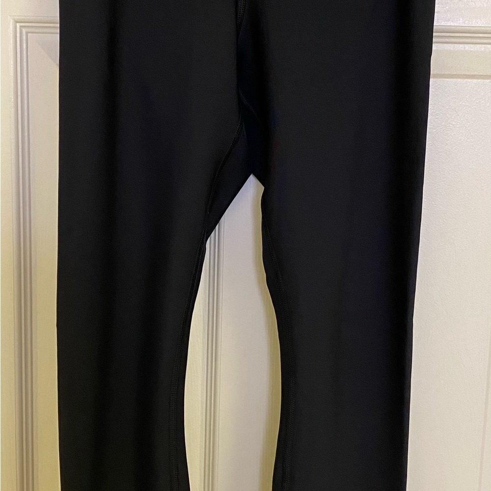 Patagonia Black fitted soft stretch running leggings with zipper at ankles